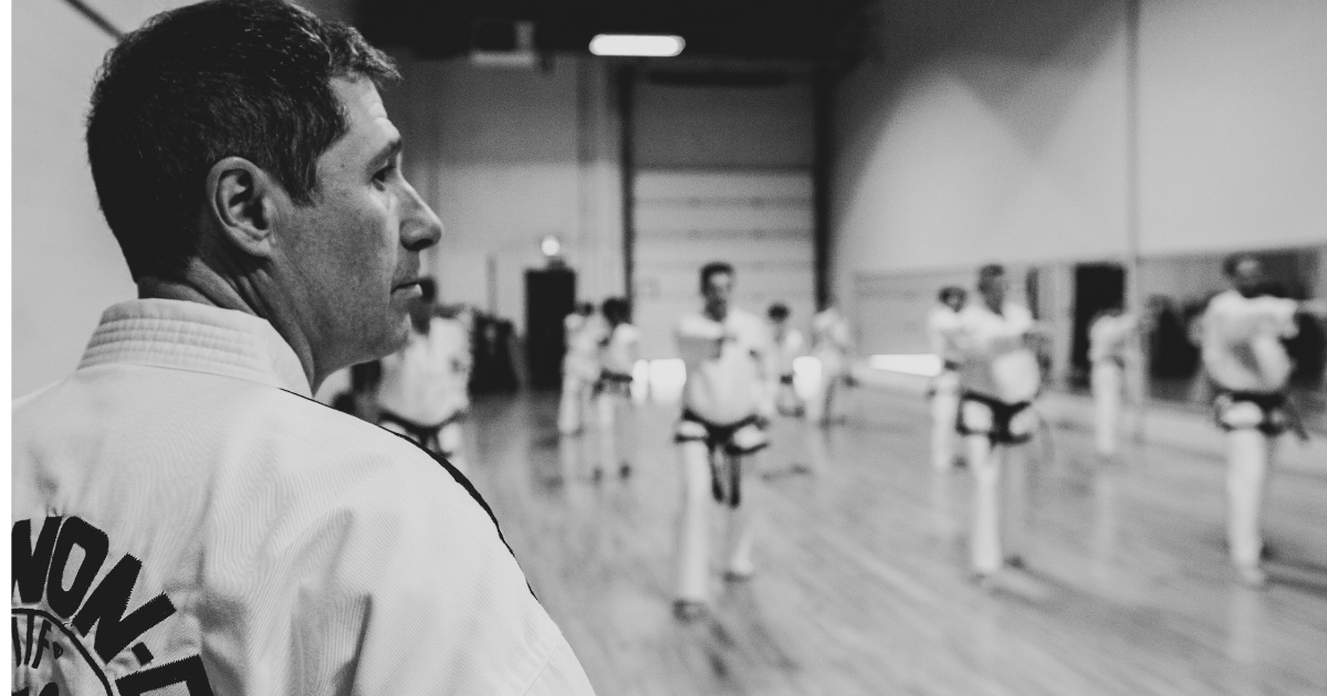 taekwondo instructor teaching kids martial arts class in one of our summer camps